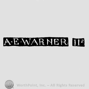 The name A E Warner written with uppercase letters and two vertical lines followed by an exponential number 2.