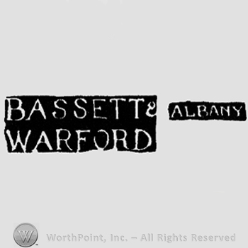 The name Bassett&Warford placed one over the other written with uppercase letters and the name Albany written with uppercase letters.