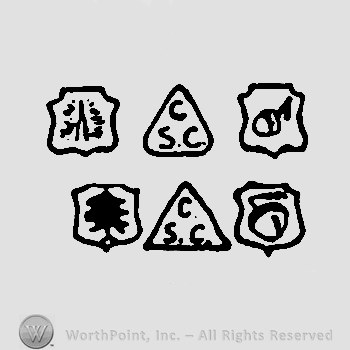 Four shields, each with a different image in it and two triangles with uppercase SCC inside
