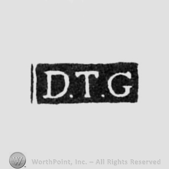 The letters D.T.G. written in uppercase