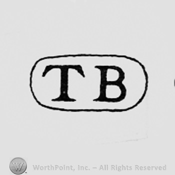 Letters T and B inside a frame like an oval.