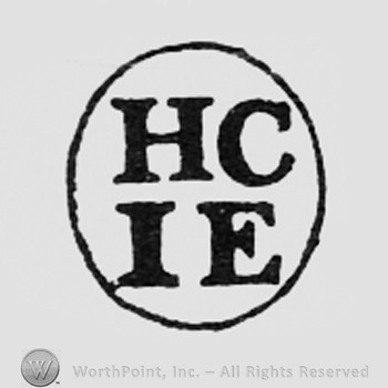 Letters HC and IE inside an oval.