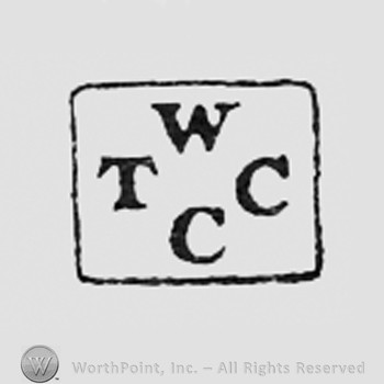 Letters W T C C inside a rectangle.