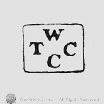 Letters W T C C inside a rectangle.