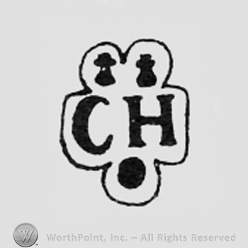 Two little shapes above letters CH.