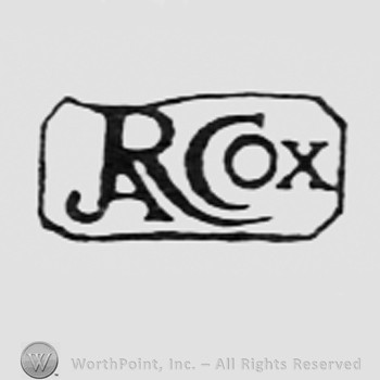Letters R COX inside a rectangle.