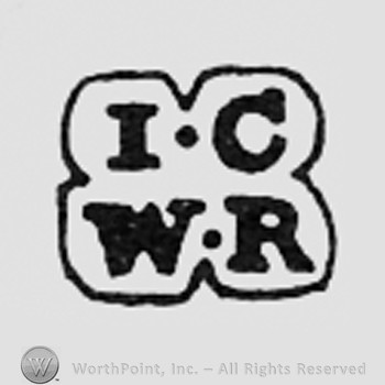 Letters IC WR inside a shape like a clover.