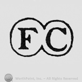 Letters FC inside a double circle.