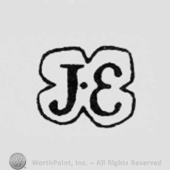 Letters J and E inside a double circle.