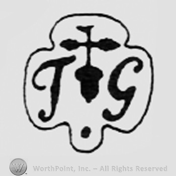 Letters Tg and a fleur-de-lis between.