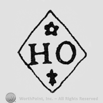 Letters HO, flower and fleur-de-lis, all inside a diamond.
