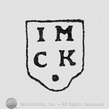 Letters IM CK on a shape like a shield.