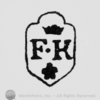 Letters FK, a crown and a flower, all on a shield.