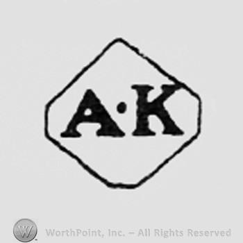 Letters AK inside a dimond.