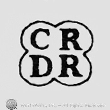 Letters CR DR inside a shape like a clover.