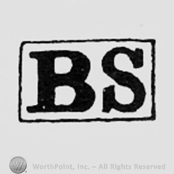 Letters BS inside a rectangle.