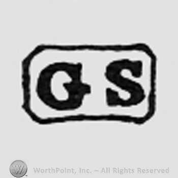 Letters GS inside a rectangle.