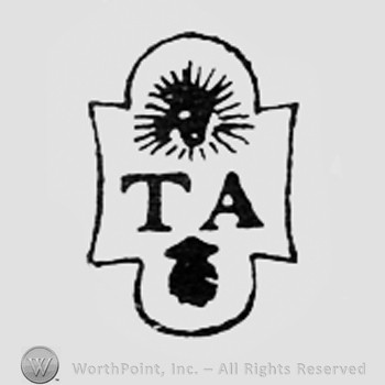 Shape like a sun, letters TA and a dot.