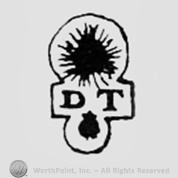 Shape like a sun, letters DT and a dot.