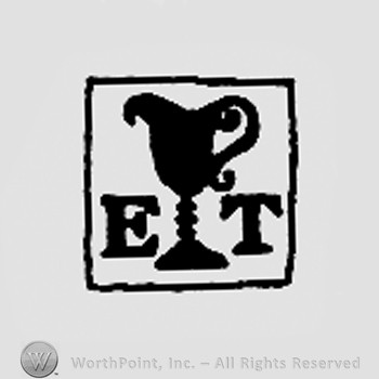 Cup between letters ET, all inside a square.