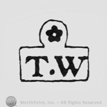 Flower above letters TW.