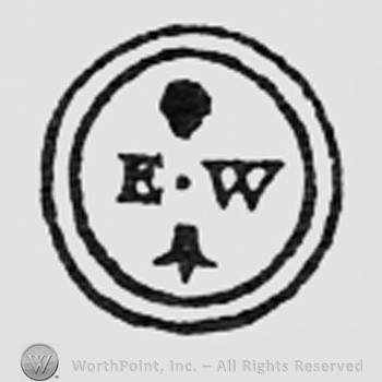 Letters EW, dot and fleur-de-lis, all inside a double circle.