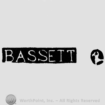 The name Bassett written in uppercase letters and the profile of a stylized bird.