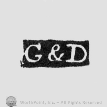 The letters G & D written in uppercase