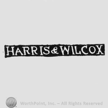 The name Harris & Wilcox written with uppercase letters