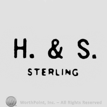Uppercase H&S written over Sterling, written also with uppercase letters