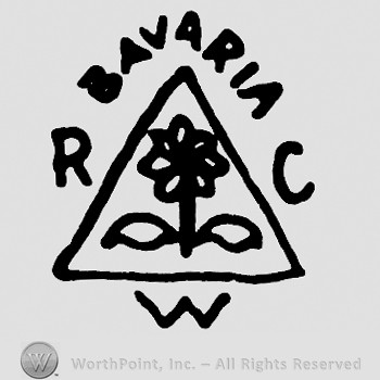 Flower inside a triangle and BAVARIA R C W written.