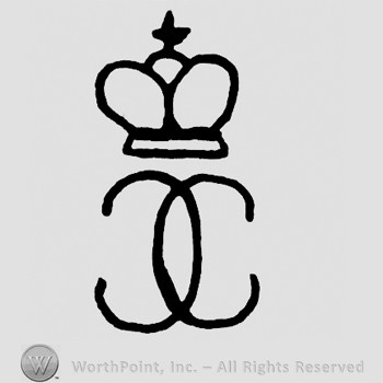 A crown with a cross on top and two letters C,one upside down.