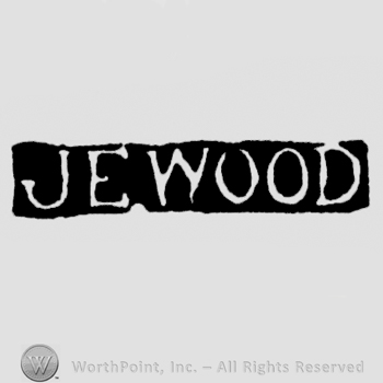 The name J.E. Wood written with uppercase letters