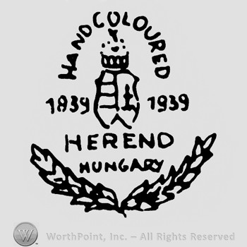 Shape made from a crown and a shield in the middle with number 1939 and Herend Hungary written below;Handcoloured on top;branches on sides.
