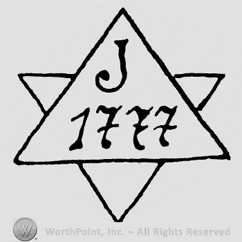 Two crossed triangles with J 777 inside.