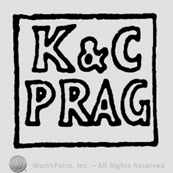 Square with K&C Prag written inside.