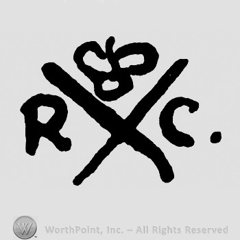 Letters X R C and a crown.