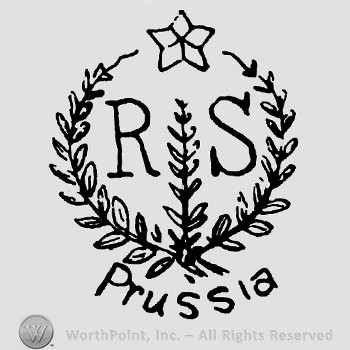 A circle made from branches with a star on top;letters R S inside;Prussia written outside.