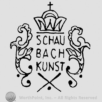 Crown with cross on top;Schau Bach Kunst and letter X below.