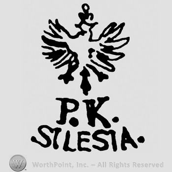Eagle with a crown on top;PK SILESIA written below.