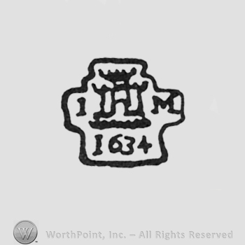 capital initials IM left and right of a castle 1634 under surrounded by black line