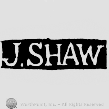 The name J. Shaw written with uppercase letters