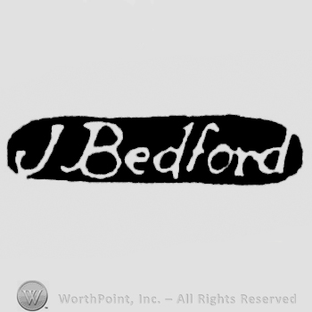 The name J. Bedford written with lowercase letters, leaned to the right
