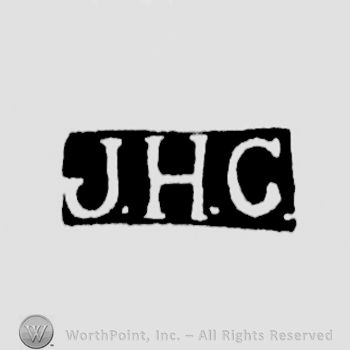 The letters J.H.C. written in uppercase