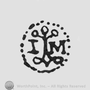 capital initials I, M left and right of a tree all inside a dotted circle