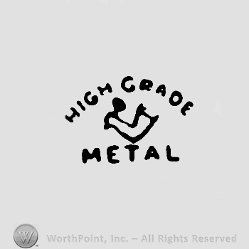 Hand holding a hammer, High Grade Metal written around it with uppercase letters. 