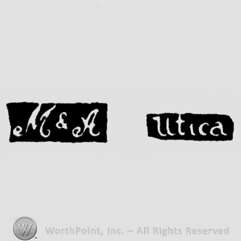 The letters M & A handwritten with uppercase letters and leaned to the right, next to 'Utica' written straight with lowercase letters