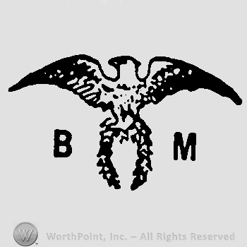 An eagle on a wreath with letter B on the left and letter M on the right.