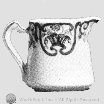 Wolferman creamer in restaurant pattern.