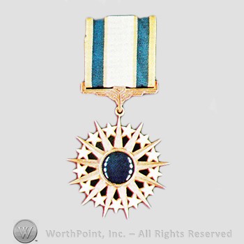 Military decoration : Air Force Distinguished Service Medal.